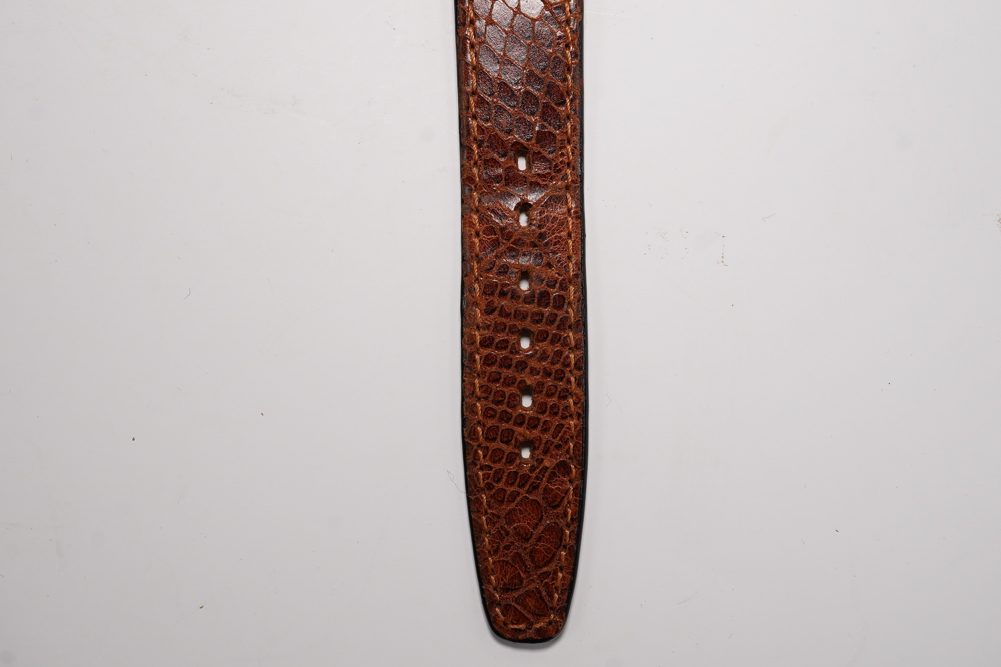 A gentleman's steel Longines manual wind wrist watch, with Arabic and baton numerals, and subsidiary seconds, movement c.11L, case diameter 30mm, on a later associated leather strap. Condition - poor